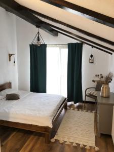 Postel nebo postele na pokoji v ubytování Cabana Dintre Fagi