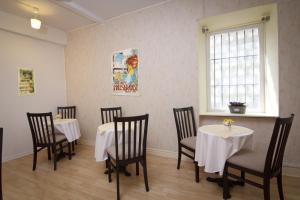 a dining room with tables and chairs and a window at Bed & Breakfast Vila Baguc in Split +37 photos