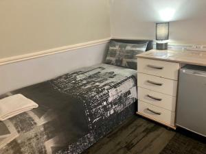 a small room with a bed in the corner at Private stay @ London-Stratford. in London