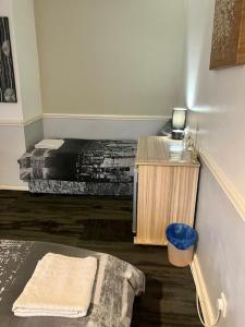a room with a bed and a desk with a bed sidx sidx sidx at Private stay @ London-Stratford. in London