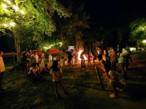 a crowd of people in a park at night at YesHue Eco in Hue