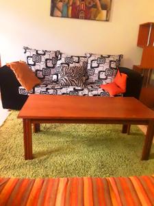 a living room with a couch and a coffee table at New Kitisuru A in Nairobi