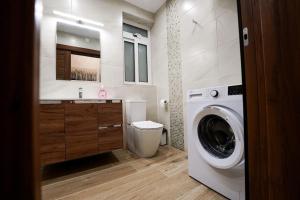 a bathroom with a washing machine and a washer at Lovely apartment by the sea. MF1 in St Paul's Bay