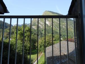 a view of a mountain from a balcony at location MIRANDE 2 chambres 4 couchages in Laruns