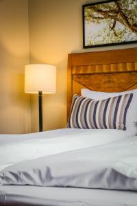 Postel nebo postele na pokoji v ubytování First Hotel Millennium