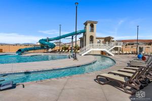 a swimming pool with a slide in a resort at The Bend at Paseos in Washington