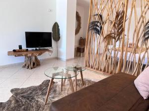 a living room with a couch and a tv at Boutique Casa Lapicida in Calpe