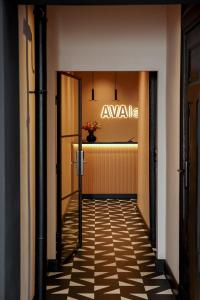 a hallway with an avenue sign on the wall at Hotel AVAlex in Berlin