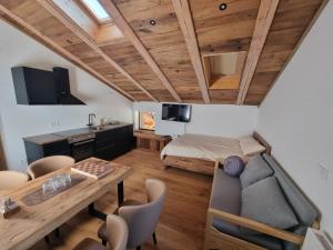 a living room with a couch and a table at Apartments Bedanc in Kranjska Gora