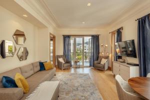 a living room with a couch and a tv at Porto Montenegro in Tivat