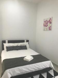 Giường trong phòng chung tại Homestay Fe-feeling Artis with 4 Bedrooms