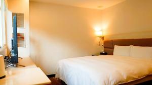 Krevet ili kreveti u jedinici u okviru objekta Hub Hotel Banqiao Branch