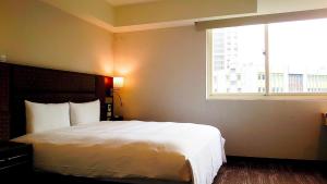Krevet ili kreveti u jedinici u okviru objekta Hub Hotel Banqiao Branch