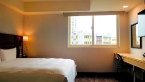 Krevet ili kreveti u jedinici u okviru objekta Hub Hotel Banqiao Branch