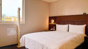 Krevet ili kreveti u jedinici u okviru objekta Hub Hotel Banqiao Branch