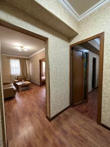 an empty living room with a door and a living room at Giza in Yerevan