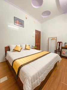 Giường trong phòng chung tại My Kim Hotel - Ngay Bến Ninh Kiều