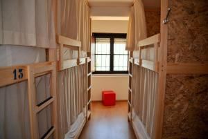 A bunk bed or bunk beds in a room at Allmar Hostel