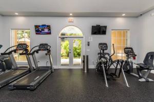 a gym with treadmills and exercise bikes in a room at Luxury VIP 3 Bed 2 Bath Apartment Yacht Club Aventura in Miami