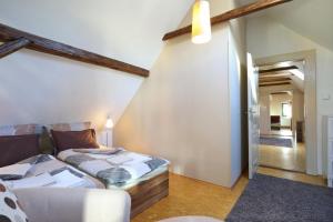 Postel nebo postele na pokoji v ubytování Apartmány Milenium