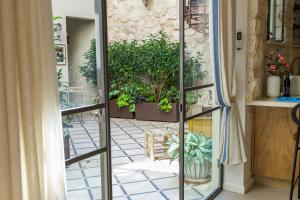 a room with a glass door leading to a patio at David Zehavi Apt #2 in Tel Aviv