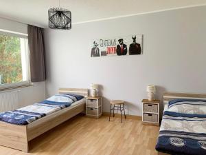 Postel nebo postele na pokoji v ubytování Apartments Hemer