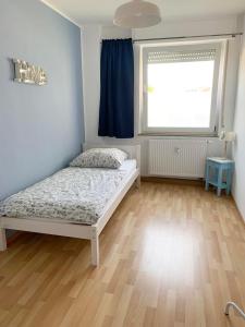 Postel nebo postele na pokoji v ubytování Apartments Hemer