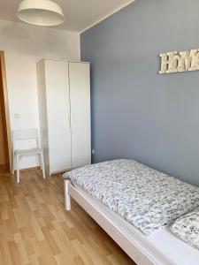 Postel nebo postele na pokoji v ubytování Apartments Hemer