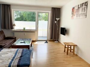 TV a/nebo společenská místnost v ubytování Apartments Hemer
