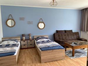 Postel nebo postele na pokoji v ubytování Apartments Hemer