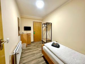 Postel nebo postele na pokoji v ubytování Pension Hubertus
