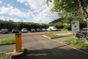 a parking lot with cars parked on the road at Genuss- und Wellnesshotel Bercher in Waldshut-Tiengen