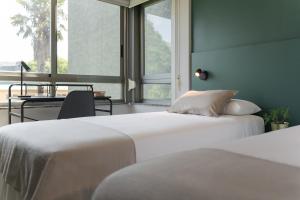 Posteľ alebo postele v izbe v ubytovaní Someso Apartamentos Turisticos