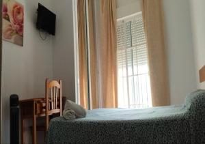 Łóżko lub łóżka w pokoju w obiekcie Hotel Betania