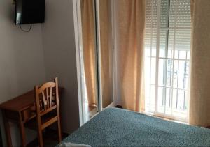 Łóżko lub łóżka w pokoju w obiekcie Hotel Betania