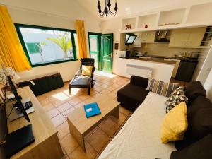 a living room with a couch and a table at Playa Park in Puerto del Carmen