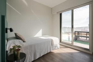 Posteľ alebo postele v izbe v ubytovaní Someso Apartamentos Turisticos