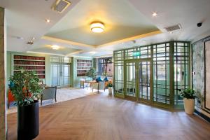 an office with a hallway with chairs and bookshelves at Waterford Marina Hotel in Waterford