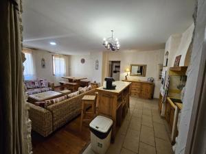a living room with a couch and a table at Blaise 4 pieces in Saint-Étienne-de-Tinée