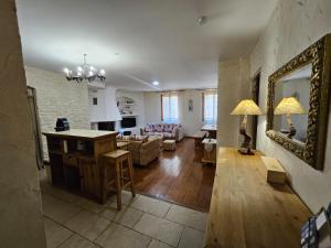 a living room with a couch and a table at Blaise 4 pieces in Saint-Étienne-de-Tinée