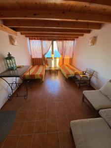 a living room with a couch and a table at Casa Natalie in El Cotillo