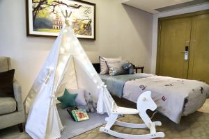 a childs bedroom with a bed and a tent at Melia Hanoi in Hanoi