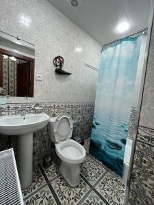 a bathroom with a sink and a toilet and a shower at Old Safari Golden Location Guest house with Laundry Service in Bukhara +42 photos