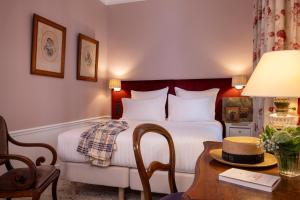 Postel nebo postele na pokoji v ubytování Hotel Le Saint Gregoire