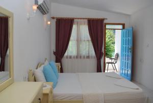 Postel nebo postele na pokoji v ubytování Myra Hotel