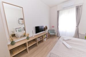 Televízia a/alebo spoločenská miestnosť v ubytovaní Madách Fox Apartment