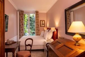 Postel nebo postele na pokoji v ubytování Hotel Le Saint Gregoire