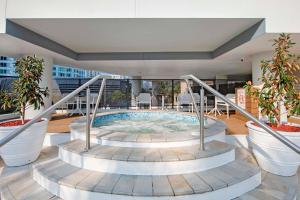 a hot tub on the roof of a building at Romantic Getaway in Surfers Paradise - Elston Apartment with Ocean View - Wow Stay in Gold Coast