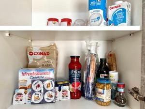 a refrigerator shelf filled with food and other food items at Moonlight in Castellammare di Stabia