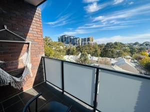 a balcony with a view of a city at Imagine house in Sydney